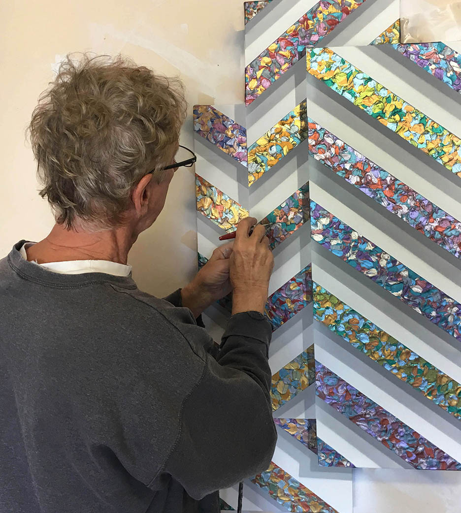 Jack Reilly adding illusionistic shadows to the painting "Point to Point" 2017 